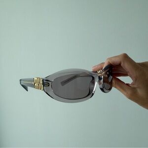 Miu Miu Black and Gold Sunglasses